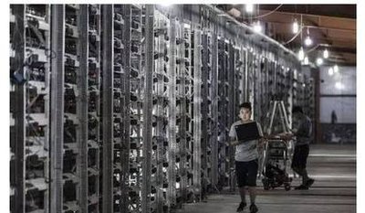 Modern mining farm facility with rows of ASIC miners